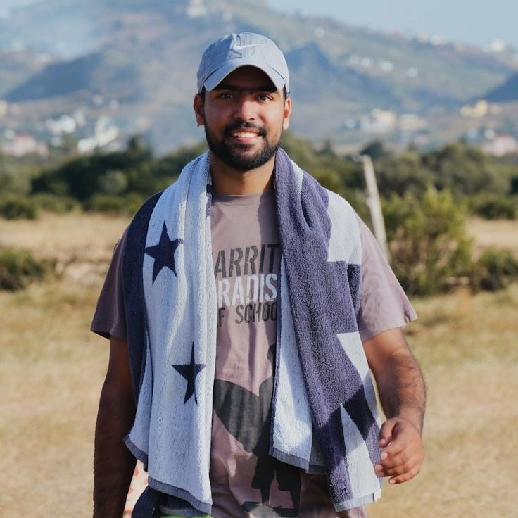 Kaveri Mehta, Lead Design Curator at Syner Quanta Vision, reviewing corporate floral arrangements
